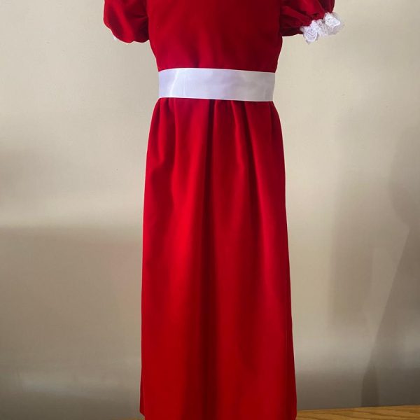 a red dress with white lace on a mannequin