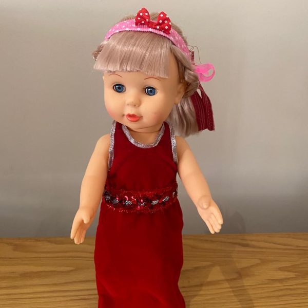 a doll in a red dress