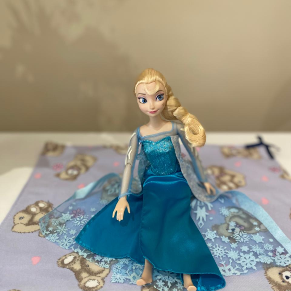 Elsa Barbie doll with blanket